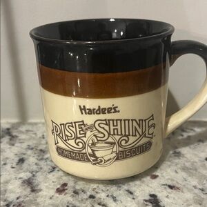 'Rise and Shine' Ceramic Coffee Mug - Cream & Brown.  Hardee’s